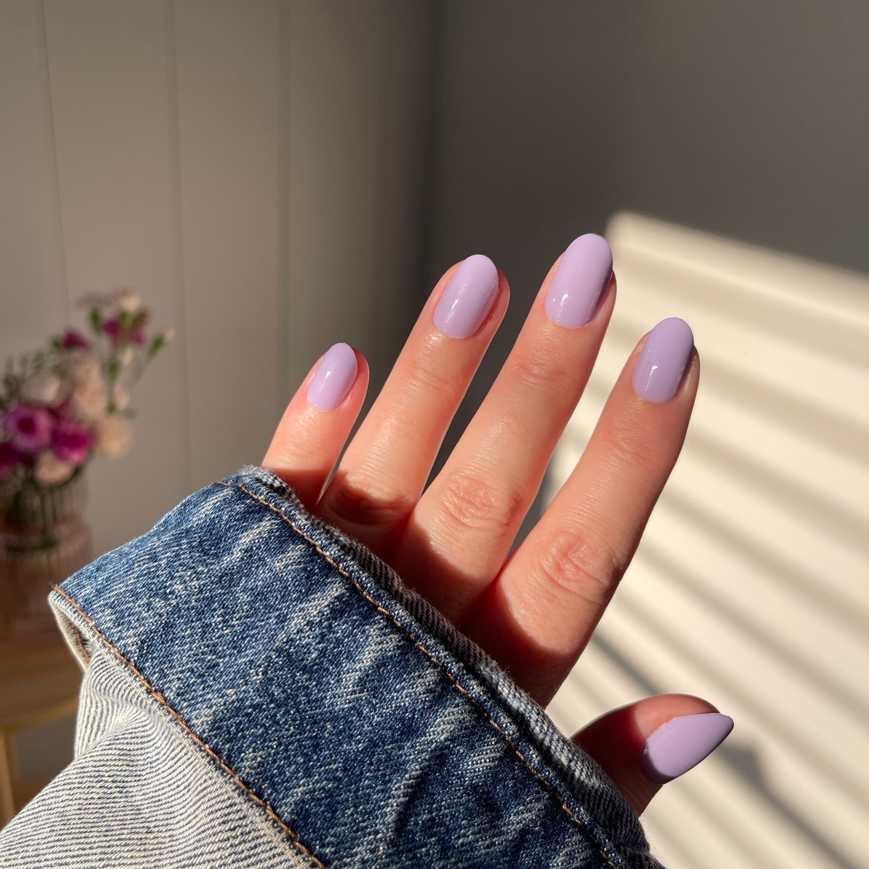 Girl wearing Instant Mani Co. Wisteria purple press on nails 