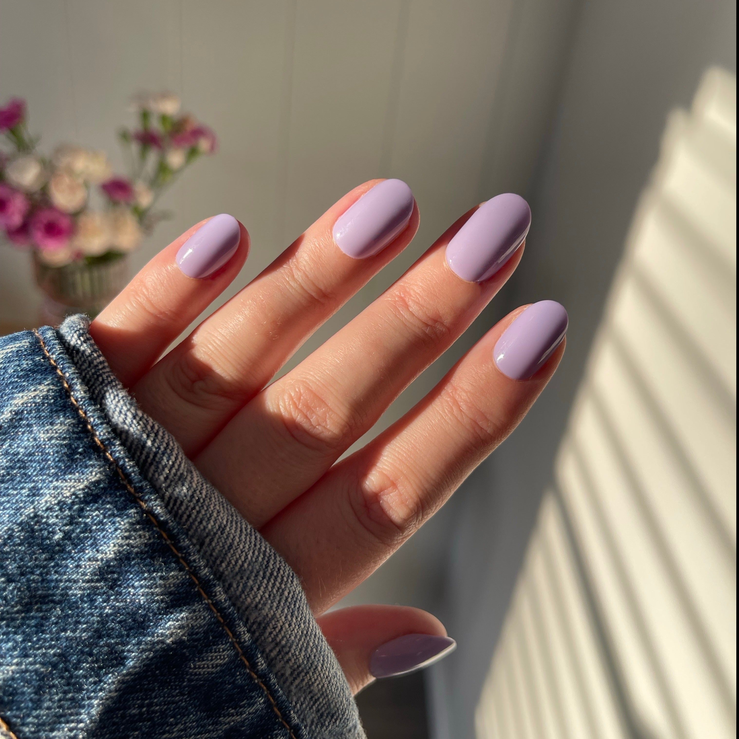 Girl wearing Instant Mani Co. Wisteria purple press on nails 