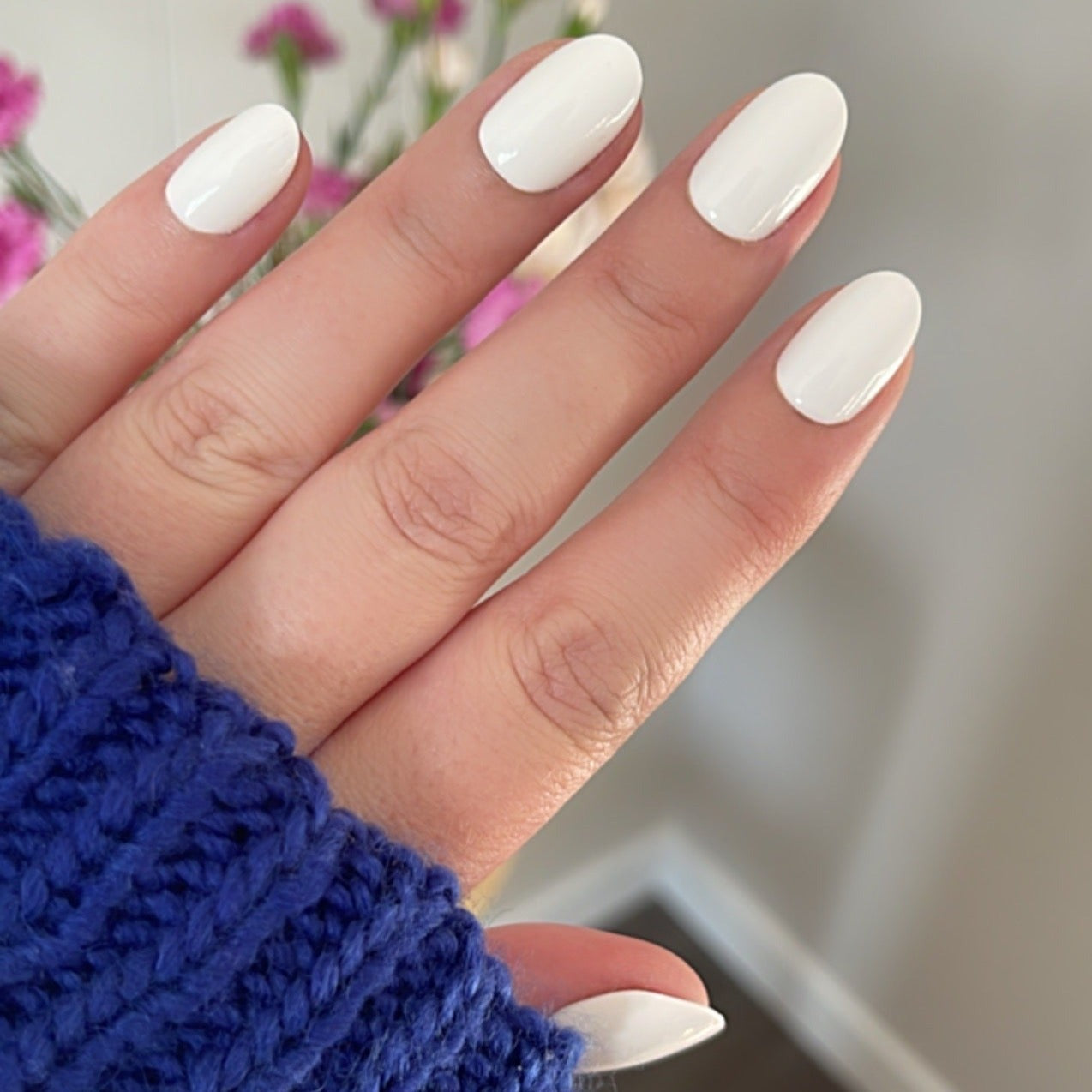 Girl wearing Instant Mani Co. Coconut Crush white short round press on nails